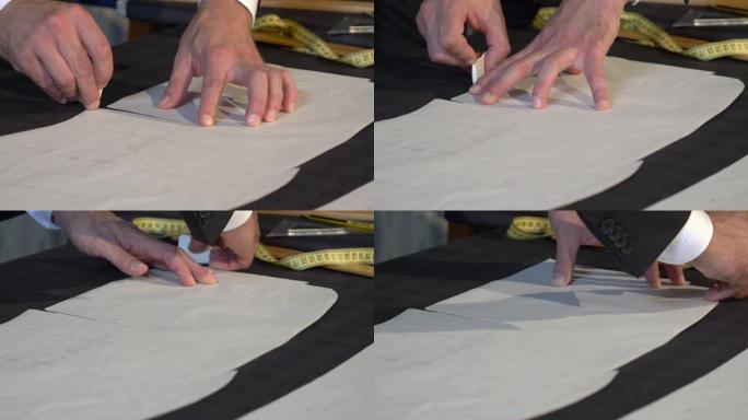 裁缝在将织物切成零件以进行进一步加工之前在织物上绘制最终线条的镜头