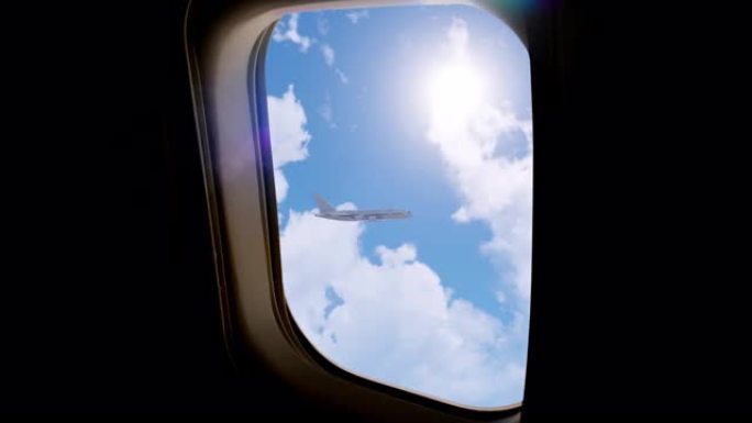 从另一架飞行中的商用飞机的窗户看，飞行中的商用飞机