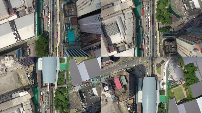 飞越吉隆坡城市阳光明媚的市中心交通街道十字路口空中俯冲全景4k马来西亚