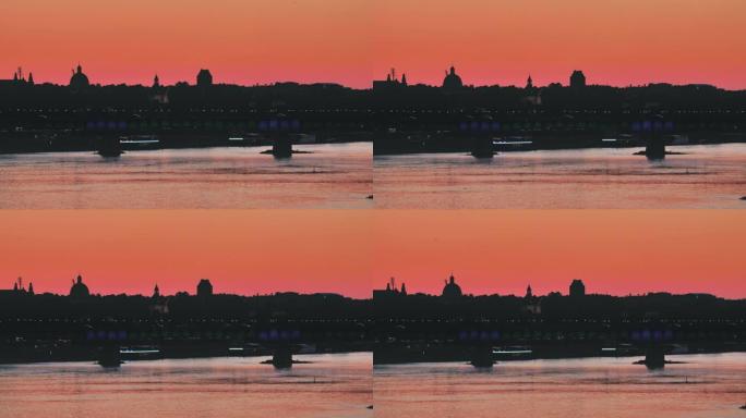 日落城市全景。河岸