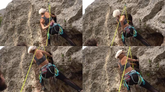 女性攀岩者在大自然攀岩