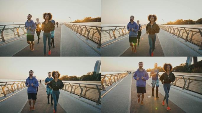 一群多种族的人在大城市的运动路上一起慢跑，慢动作