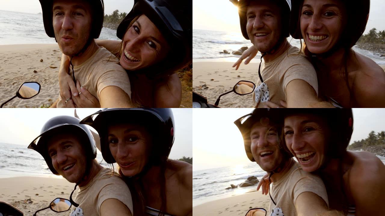 日落时，年轻夫妇在海边的踏板车上自拍。两个人用摩托车探索斯里兰卡，自拍视频，与朋友分享冒险