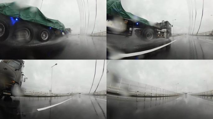 雨天开车。大雨中的交通，高速公路上的交通。镜头上的雨滴