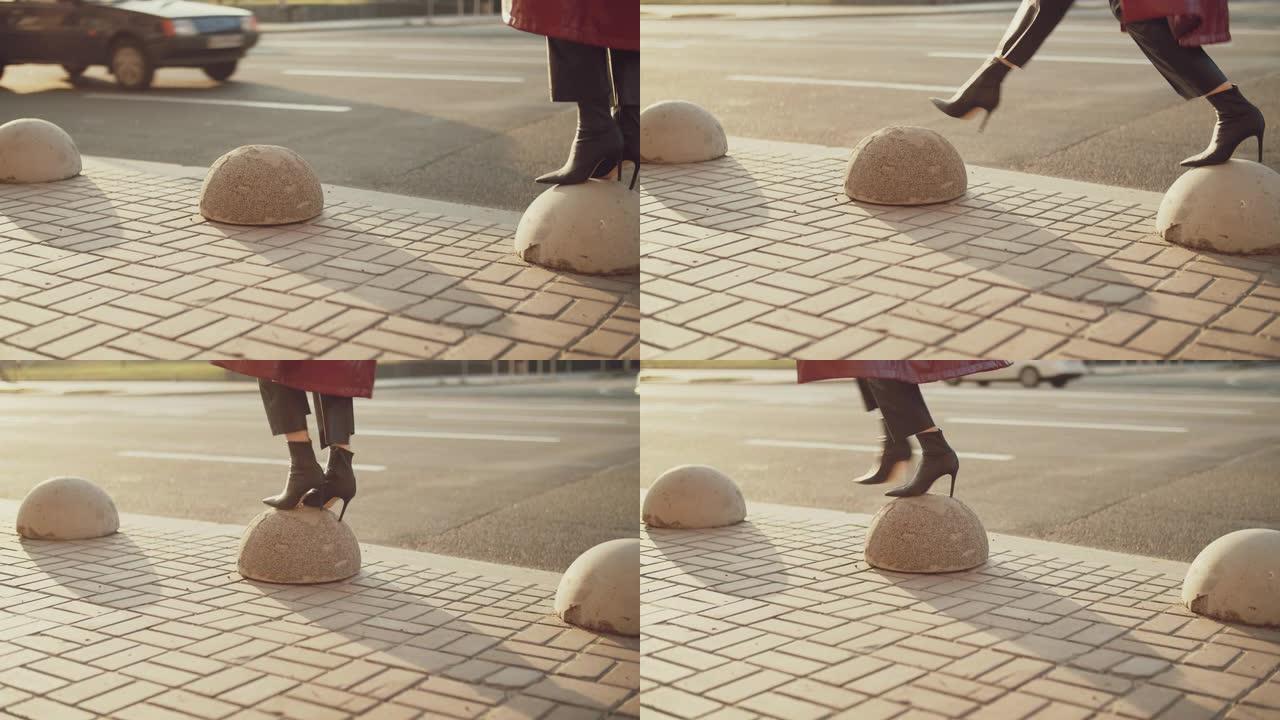 一个穿着高跟鞋的女人的腿在人行道上跳跃，走了两步