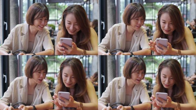 亚洲女子在餐厅聊天