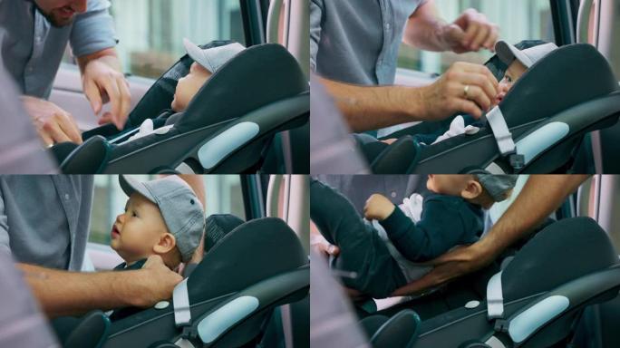 特写戴着帽子的男婴，坐在家用汽车内的婴儿汽车座椅上。门打开，他留着胡子的父亲解开安全带，小心翼翼地把
