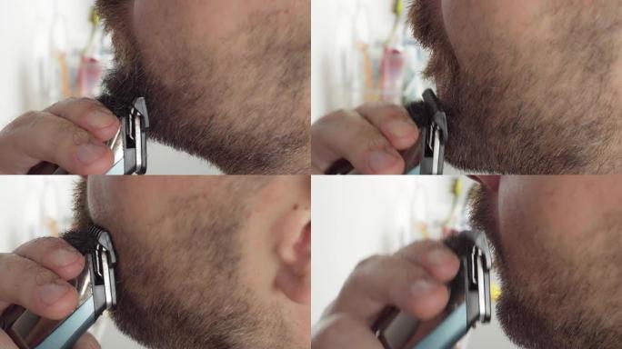 成年男子用电动打字机刮胡子