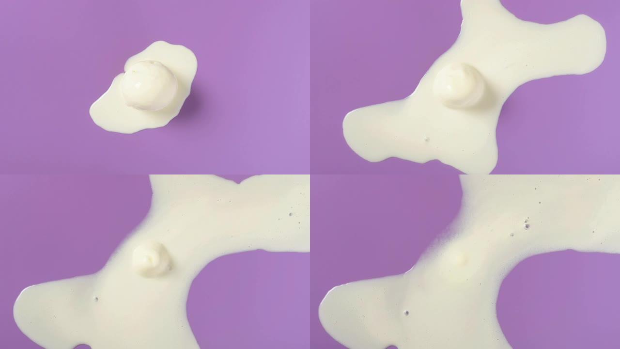 紫色背景上的顶视图香草味冰淇淋球融化延时