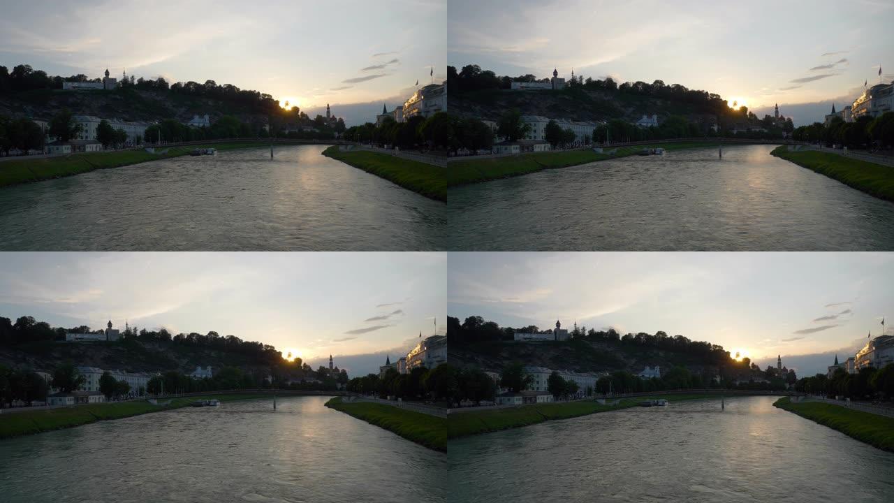 日落时间萨尔茨堡市中心河畔慢动作全景4k奥地利