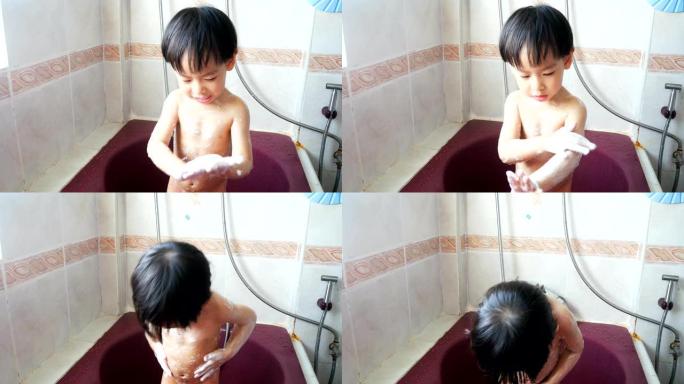 亚洲男孩在浴缸里洗澡