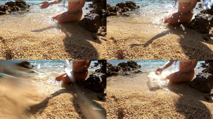 一个女人用手往相机里泼水