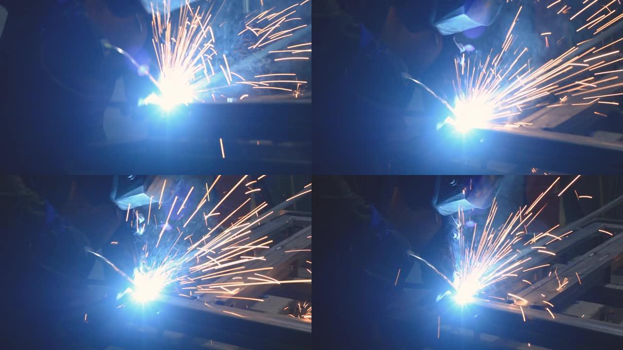 工厂的焊工焊接金属梁。工业视频