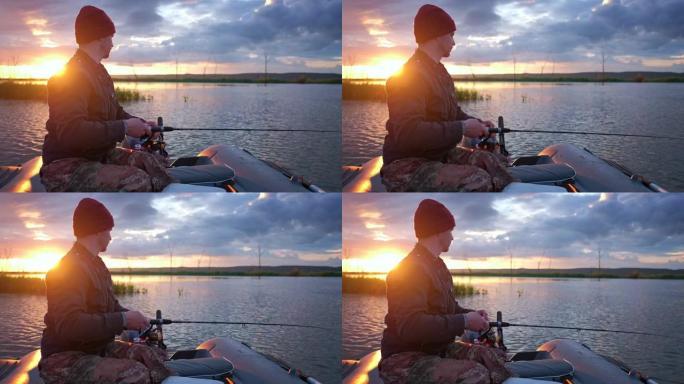 一名男子在日落时从船上在湖上钓鱼