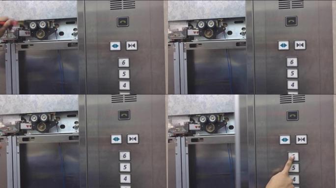电梯机械师修理电梯竖井中的电梯