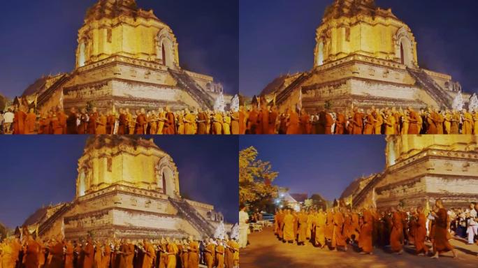 清迈泰国-FEB-19: 人们和僧侣手持点燃的蜡烛在马加普加日的塔wat chedi luang周围