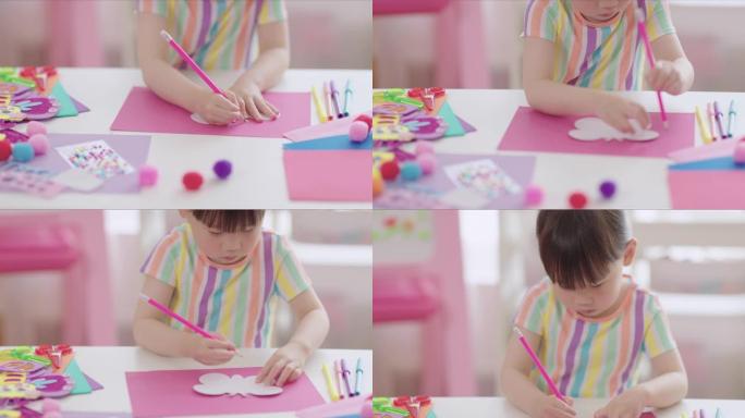 年轻女孩手绘蝴蝶形状制作纸工艺