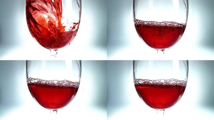 红酒倒入玻璃杯的创意宏观慢动作视频。玻璃杯与倒红酒特写。