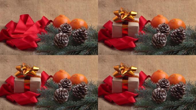 新年礼物落在框架中的桌子上。新年的组成，橘子，松果和新年树的树枝被解雇。