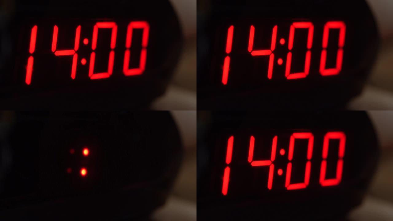 黑色数字时钟屏幕的特写显示14.00。黑色背景上闪烁红色数字。现代定时器系统和霓虹灯、电动报警装置