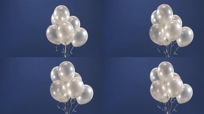 装饰元素-气球-飞入视频的框架，作为假期的惊喜: 情人节，生日，圣诞节或新年在蓝色背景上。