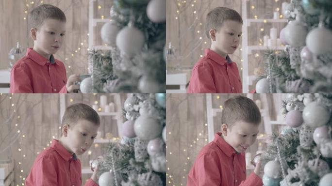 孩子看着圣诞树装饰在狂喜中微笑