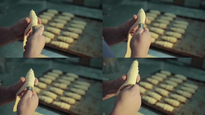 女性在烤房的厨房里制作传统的法国羊角面包。