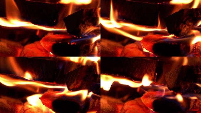 木头炉子里燃烧的木头碎片的火焰