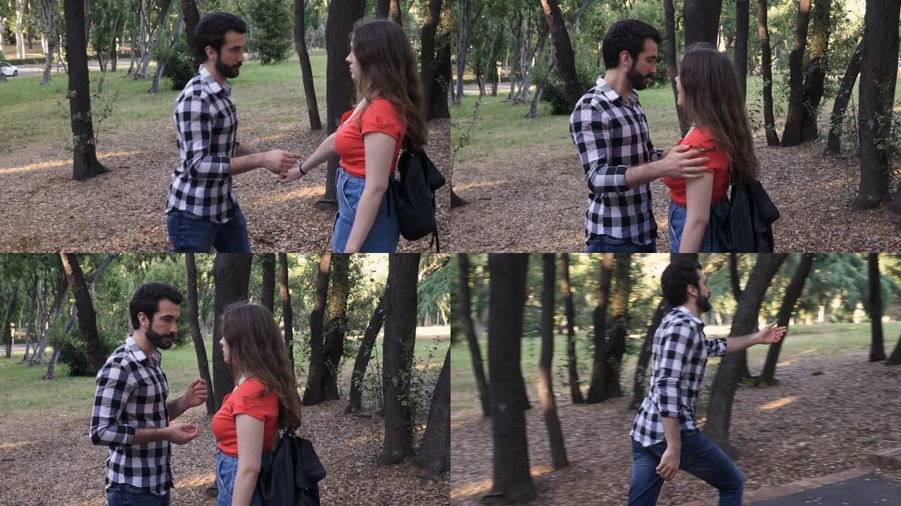 在公园吵架-年轻人试图与亲吻她的女友和睦相处