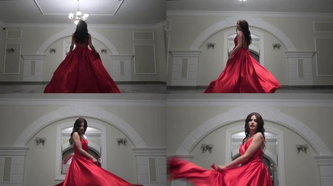 穿着红色连衣裙的美女摆姿势。时尚和风格概念。