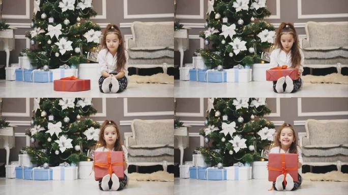 出乎意料的礼物来到可爱的女孩，她感到惊讶，哇，拿起盒子并在相机上显示。
