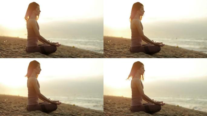 美丽的女人轻轻地呼吸的特写镜头，坐在莲花的姿势，在夏天的早晨在地中海边练习精神瑜伽。卡雷拉。巴塞罗那
