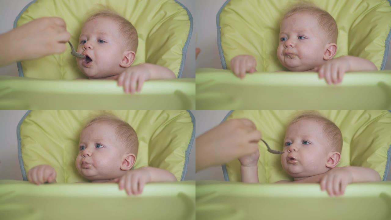 婴儿坐在高脚椅上吃饭，食欲大增