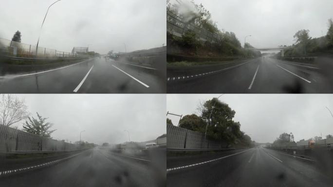 雨天开车。大雨中的交通，高速公路上的交通。镜头上的雨滴
