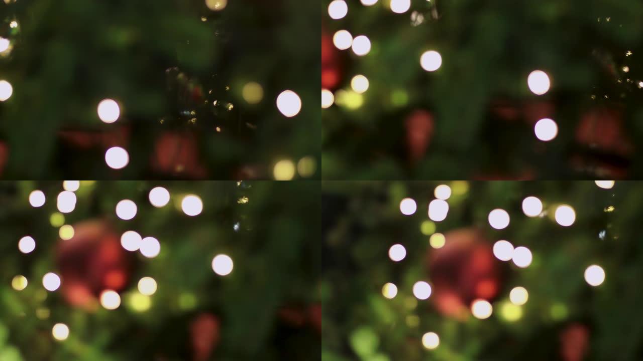 4k模糊圣诞灯Bokeh背景。闪烁的圣诞树灯闪烁。圣诞节新年假期概念。抽象，夜晚，弱光拍摄，红绿黄暖