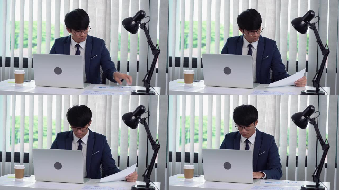 亚洲男经理在他的办公室工作。