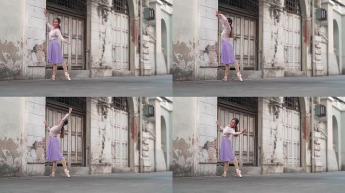 以下侧视图: 一位亚洲美丽的芭蕾舞演员以良好的姿态练习，积极的情感，在当地的街道上微笑，是当地的地标