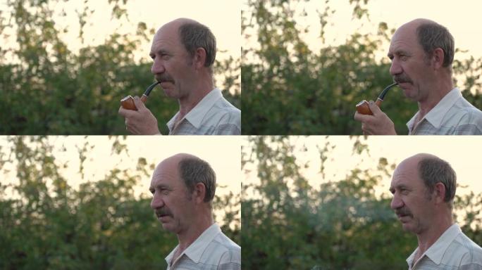 慢动作视频，一个穿着高加索人衬衫的男人，悲伤绝望的眼睛和迷失的样子抽着烟斗。在酒精吸烟的影响下幻灭的