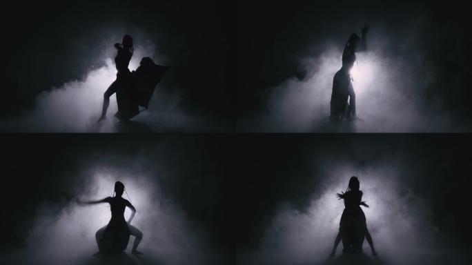 剪影舞者女人在雾中表演舞蹈人物。4k慢动作镜头。