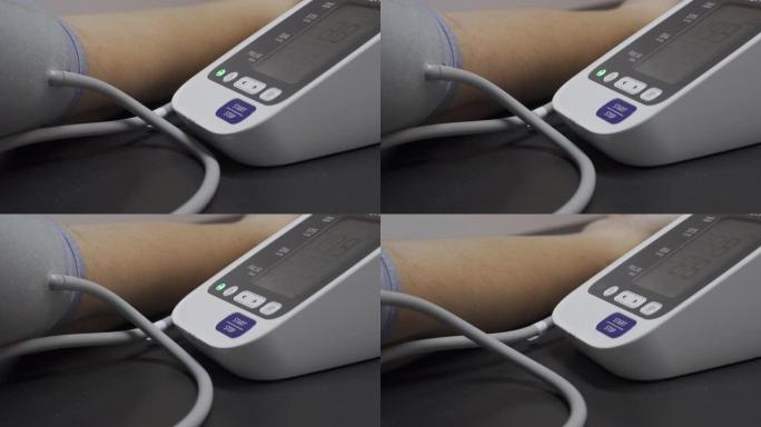 4k视频人手带血压测量监视器。