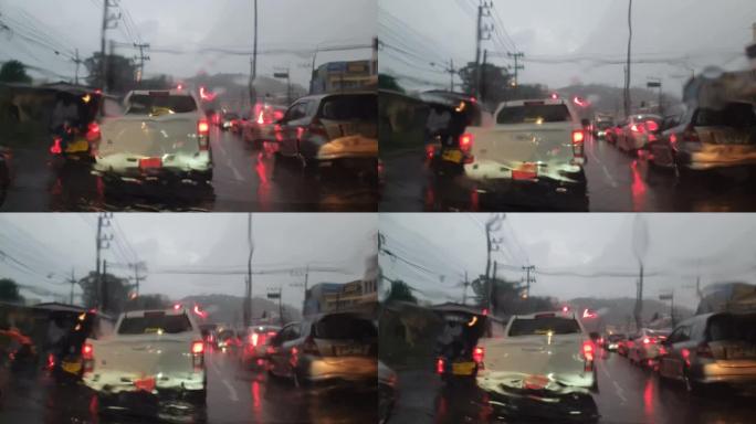 在雨中驾驶汽车红绿灯堵塞