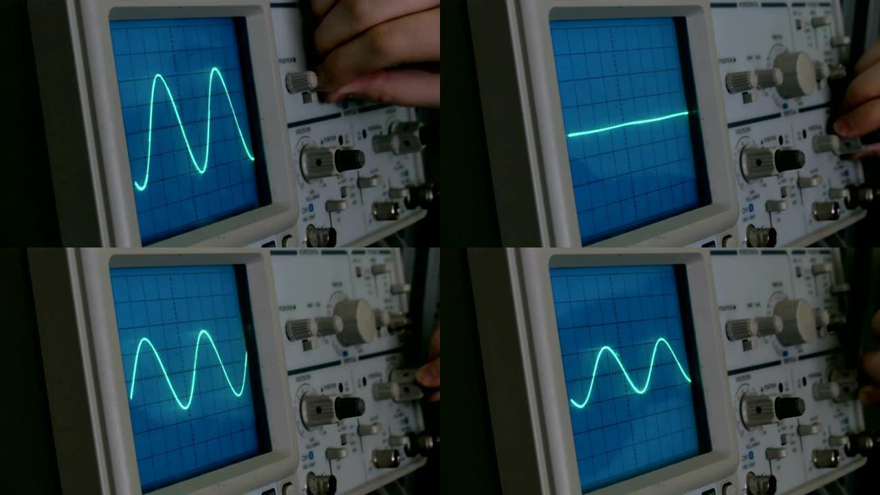 示波器上的振幅图。一个男人按下设备上的按钮。几何线改变形状