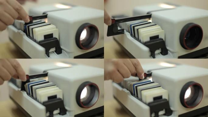 旧的幻灯片投影仪，用于特写照片，改变颜色和闪烁的光线。幻灯片投影仪。