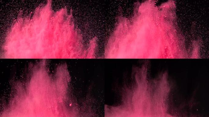 彩色红色粉末在黑暗孤立背景上的超慢动作爆炸。粉末团向上飞，与烟雾混合。