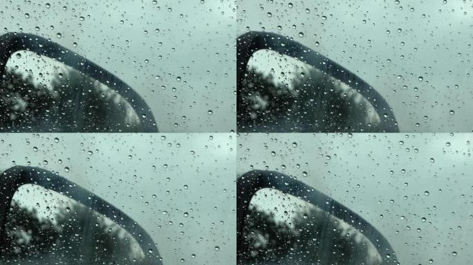 近距离观看时，雨滴从车窗上掉下来