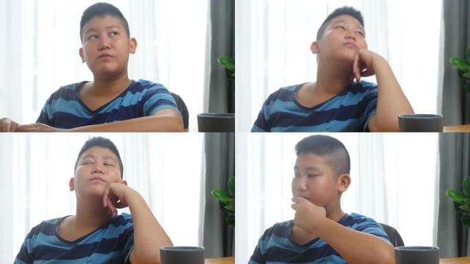 亚洲男孩在新型冠状病毒肺炎期间用笔记本电脑做作业，新的正常概念。