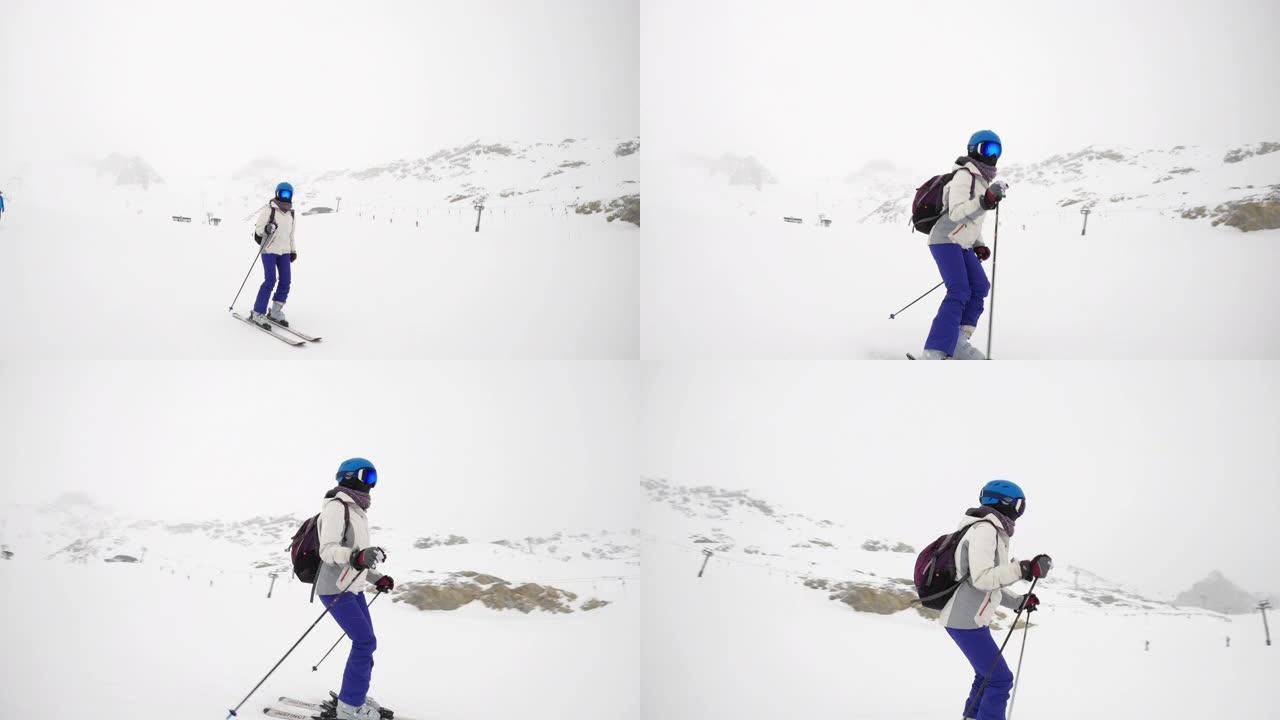 女人在阿尔卑斯山的冰川上滑雪