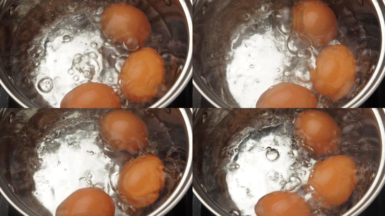 三个煮鸡蛋在沸水中