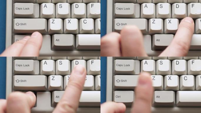 男性手指按下白色键盘上的CTRL + C按钮。慢动作和宏观视图