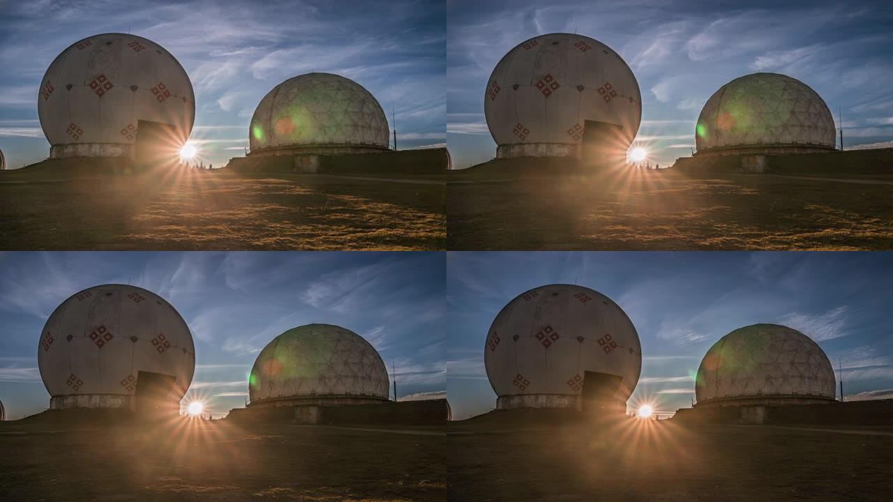 旧兵站的延时。查看带有球形屋顶的废弃雷达站帕米尔。延时视频与凉爽的云和完美的日落。